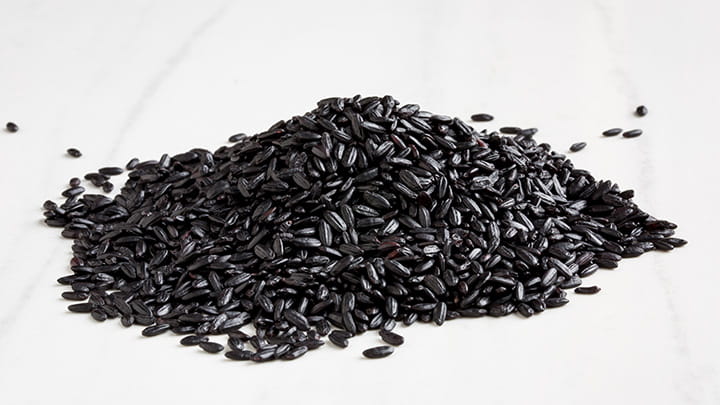 Forbidden Rice Congee with Corn Pancetta and Balsamic Drizzle