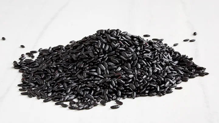 Forbidden Rice Congee with Corn Pancetta and Balsamic Drizzle