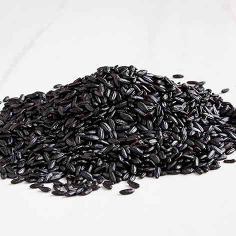 Forbidden Rice Congee with Corn Pancetta and Balsamic Drizzle