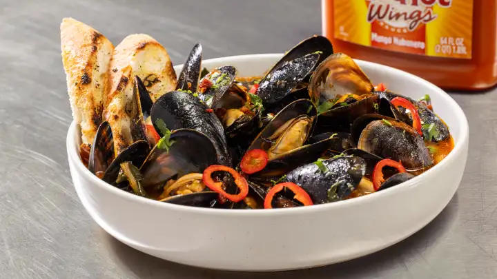 Steamed Mussels with Spicy Mango White Wine Broth