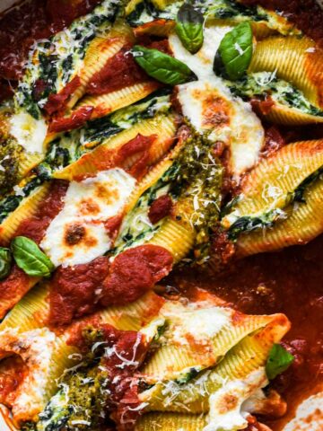 Close up shot of stuffed shells being served.
