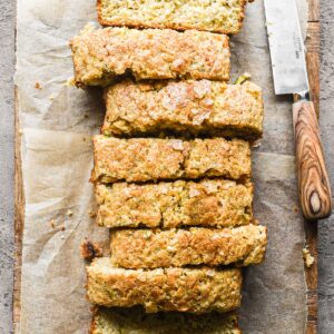 Overhead image of sliced loaf of orange zucchini bread.