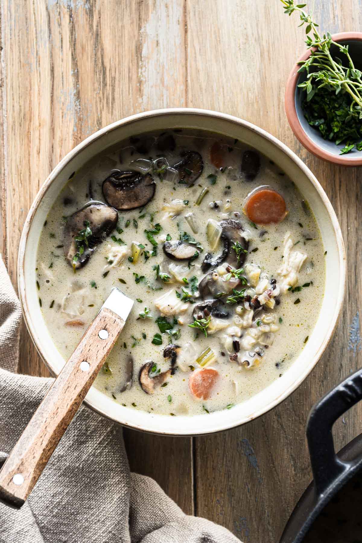 Bowl of creamy chicken mushroom wild rice soup.