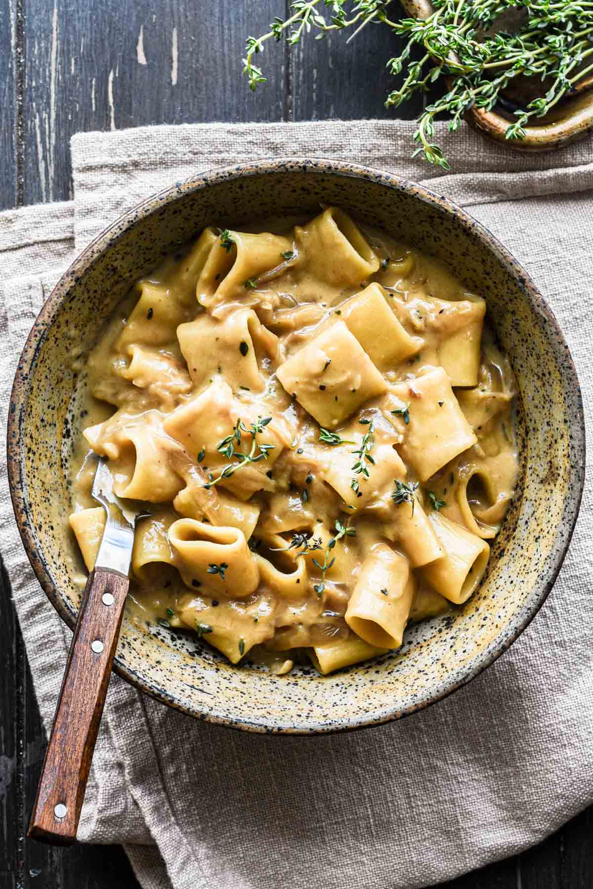 Finished french onion pasta in a bowl.