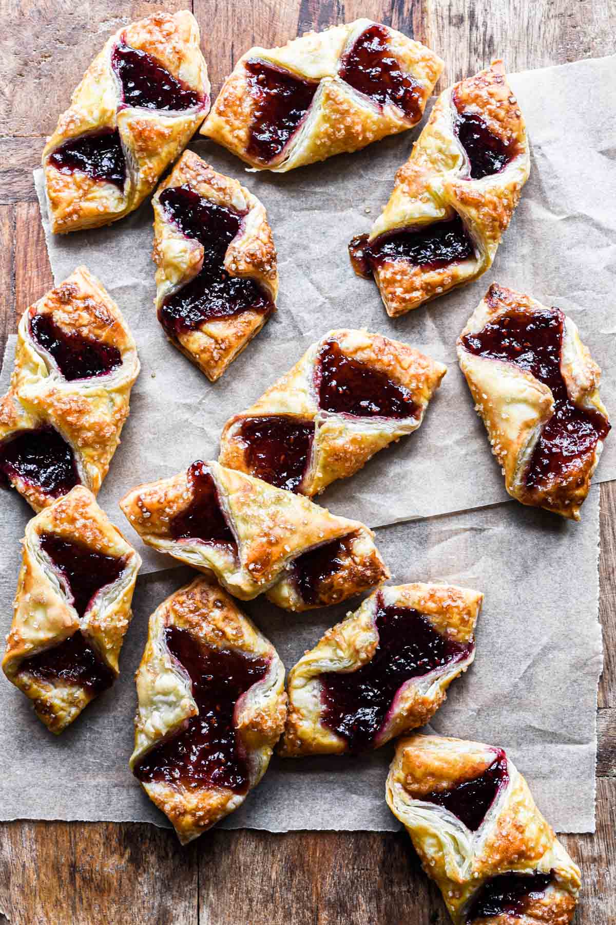 Close up image of puff pastry jam tartlets on a serving board.