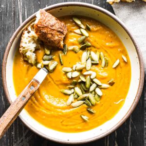 Finished bowl of roasted kabocha squash soup with pepitas.