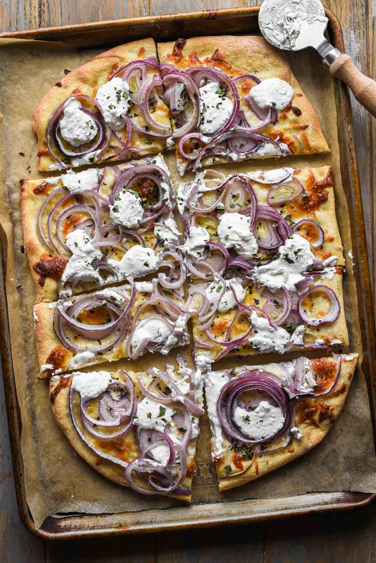 Sliced finished red onion pizza.
