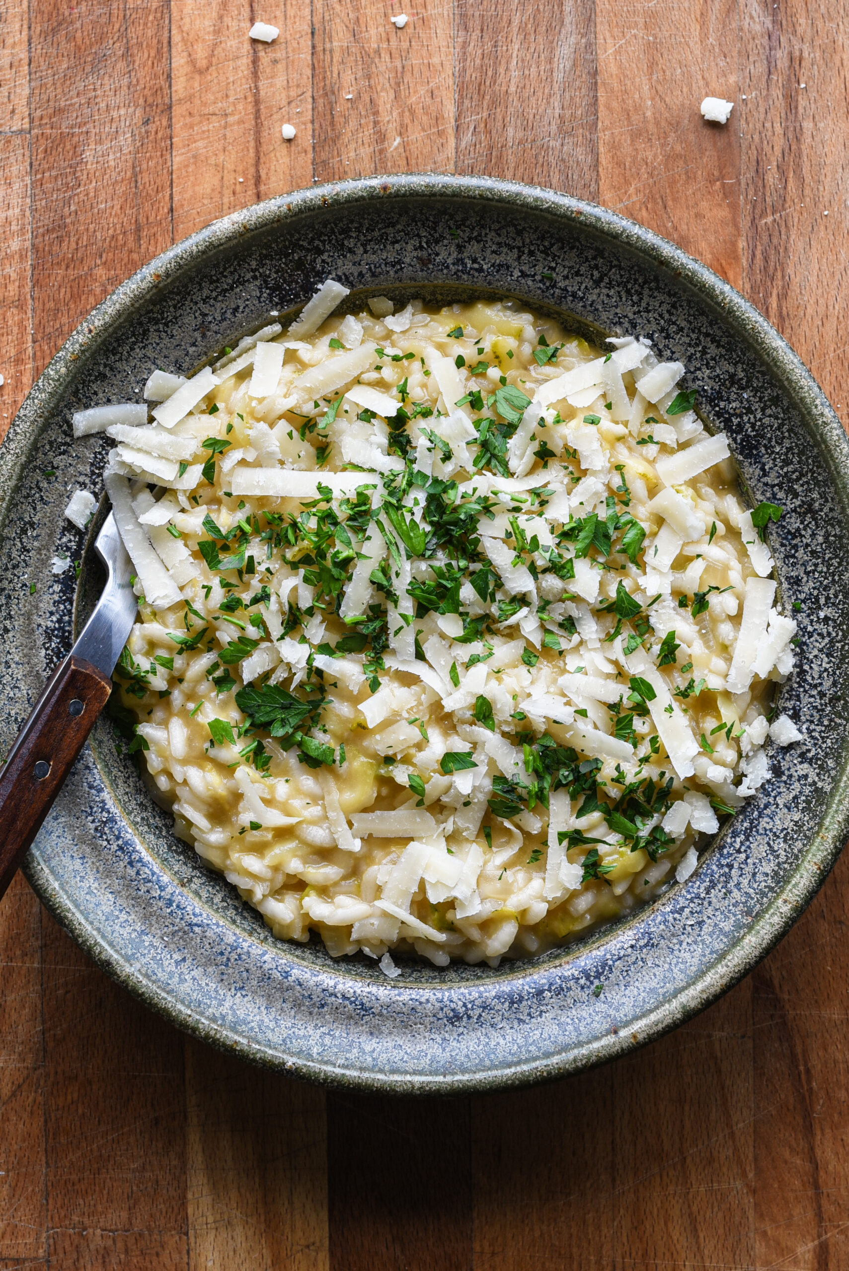 Finished dish of risotto with parsley and parmesan.