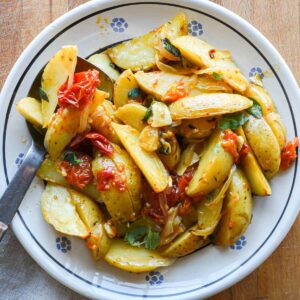 Finished roasted potatoes in a bowl for serving.