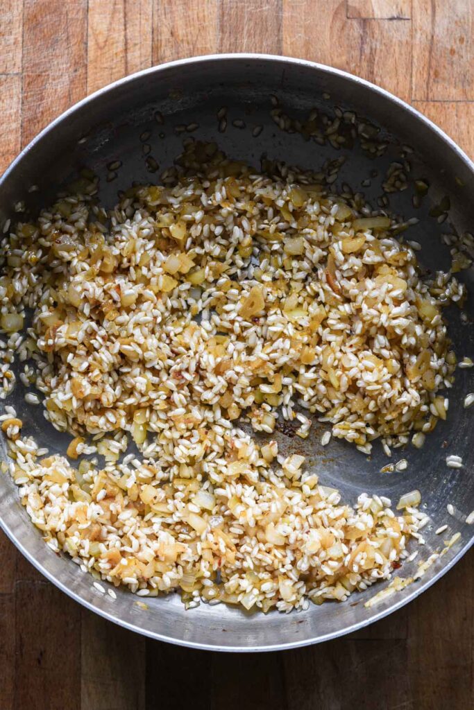 Arborio rice added to toast.