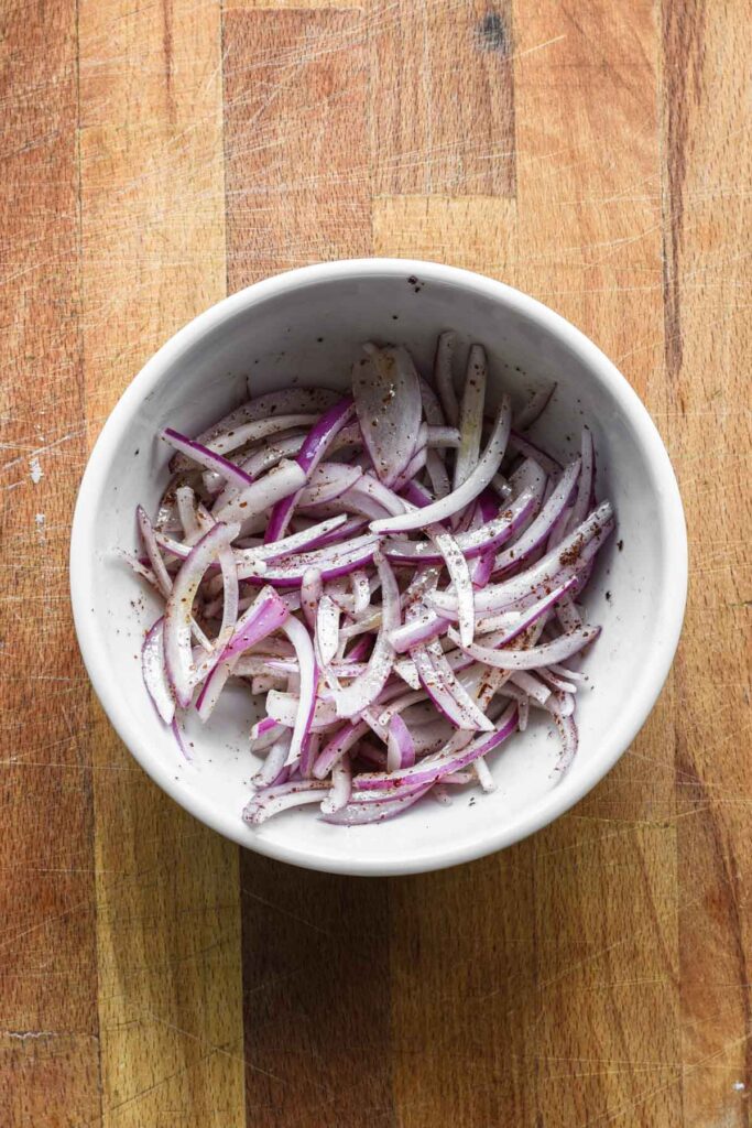Marinated onions in a bowl.