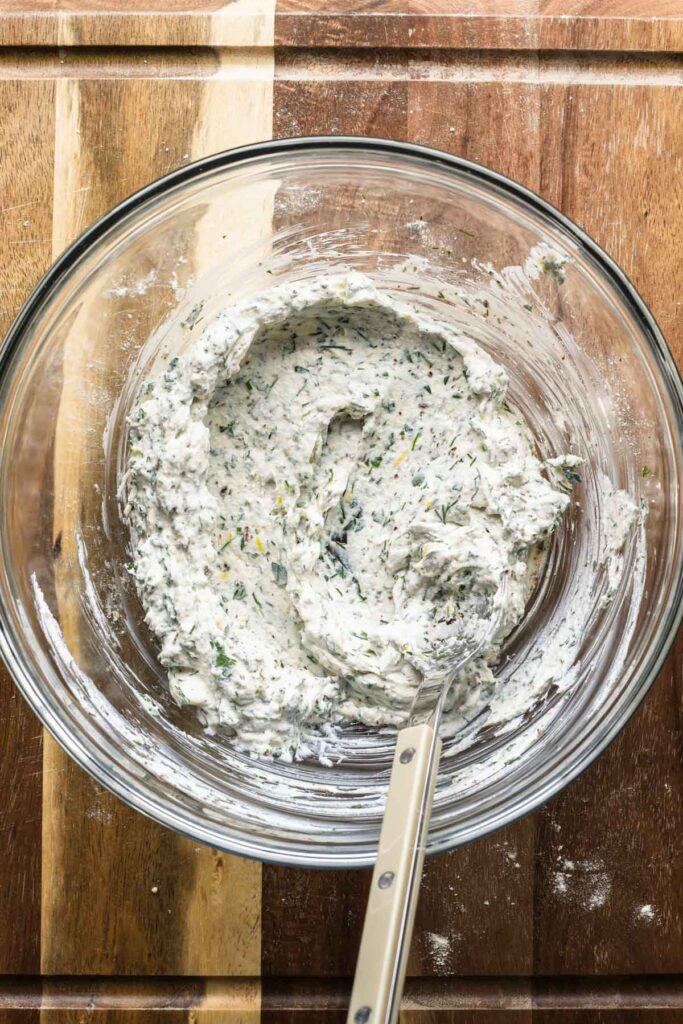 Herbed ricotta mixture in a bowl.