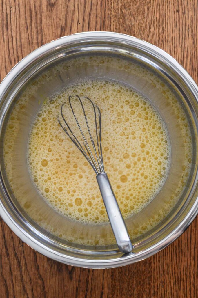 Egg and stock whisked together.