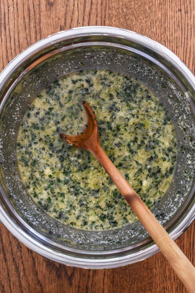 Vegetable mixture and cheese added into the egg mixture.